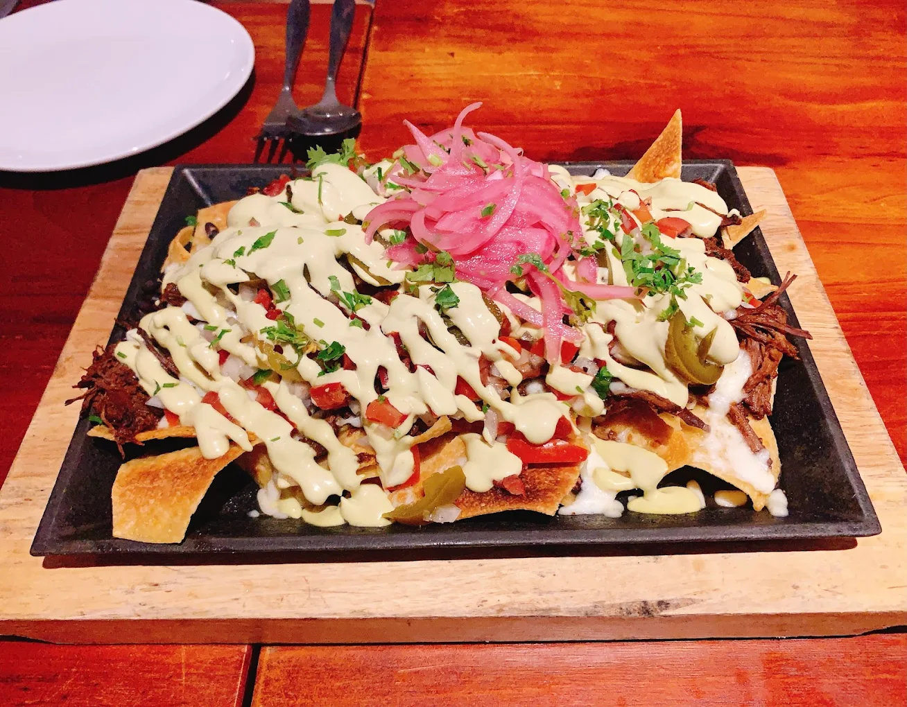 Their nachos follow the traditional Mexican style and are well-loved by many diners 